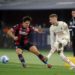 Aaron Hickey of Bologna and Samu Castillejo of AC Milan