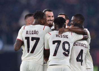 Milan players celebrate vs Roma