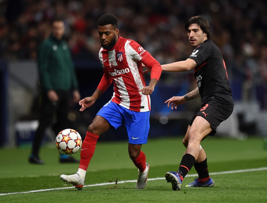 Sandro Tonali of AC Milan and Thomas Lemar of Atlético Madrid