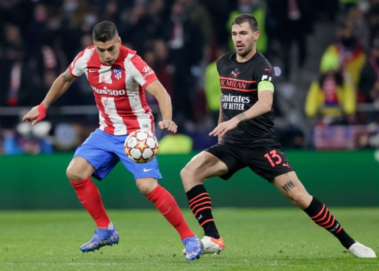 Alessio Romagnoli of AC Milan and Luis Suarez of Atletico Madrid