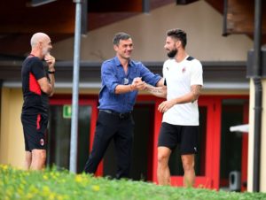 Olivier Giroud and Paolo Maldini of AC Milan