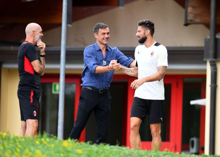 Olivier Giroud and Paolo Maldini of AC Milan
