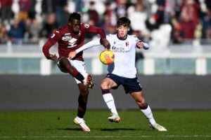 Wilfried Singo of Torino vs Aaron Hickey of Bologna