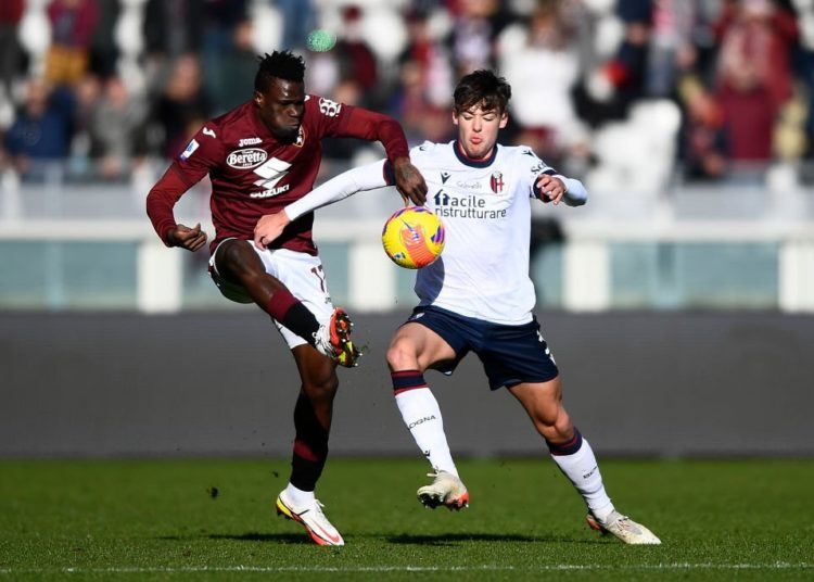 Wilfried Singo of Torino vs Aaron Hickey of Bologna