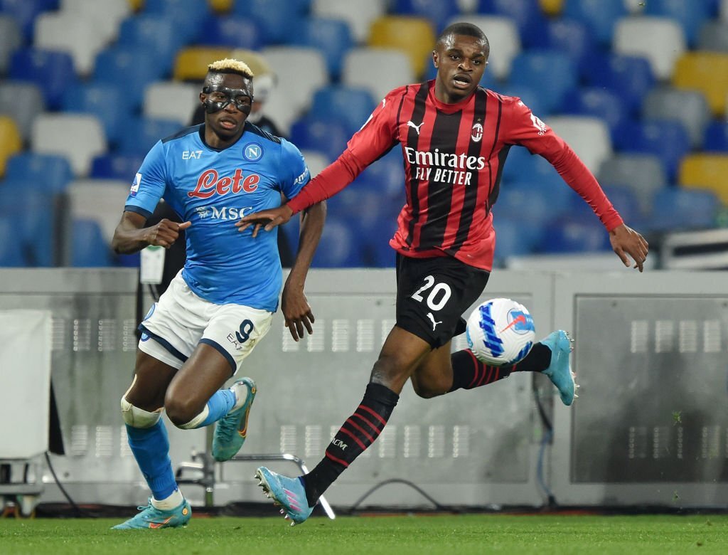 Pierre Kalulu of AC Milan and Victor Osimhen of Napoli