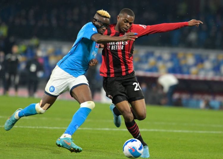Victor Osimhen of Napoli and Pierre Kalulu of AC Milan