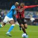 Victor Osimhen of Napoli and Pierre Kalulu of AC Milan