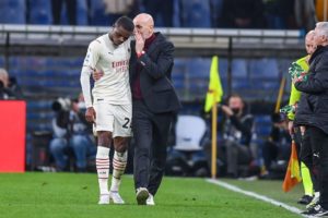 Pierre Kalulu and Stefano Pioli of AC Milan