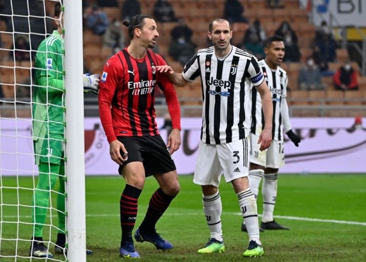 Giorgio Chiellini of Juventus and Zlatan Ibrahimovic of AC Milan