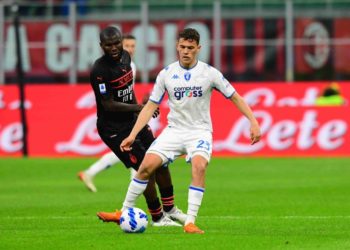 Kristjan Asllani of Empoli and Franck Kessie of AC Milan