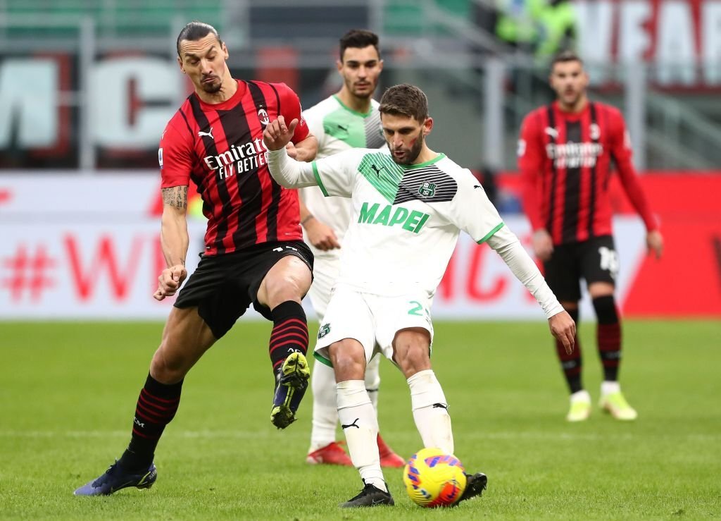 Sassuolo's Domenico Berardi and Zlatan Ibrahimovic of AC Milan