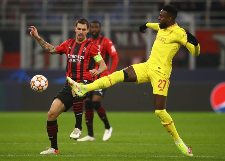Divock Origi of Liverpool and Alessio Romagnoli of AC Milan
