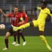 Divock Origi of Liverpool and Alessio Romagnoli of AC Milan