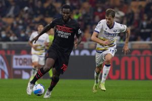 Ivan Ilic of Hellas Verona and Franck Kessie of AC Milan