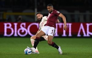 Torino's Gleison Bremer and Giroud of AC Milan