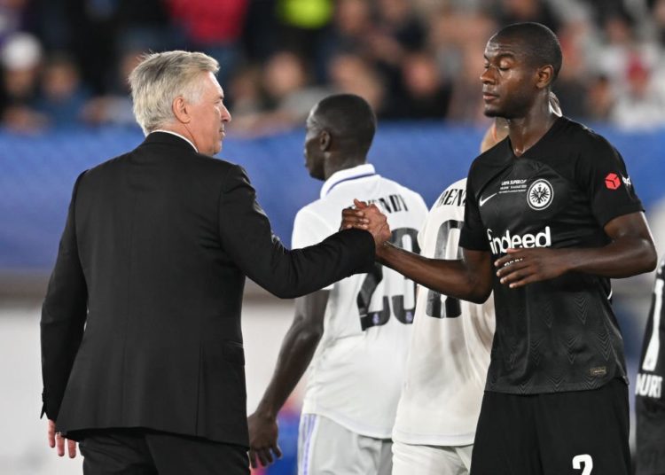 Evan N'dicka and Carlo Ancelotti