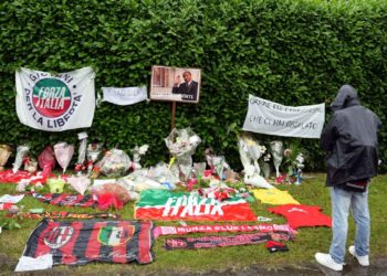 Photos, scarves and other items in tribute to Silvio Berlusconi at Villa San Martino