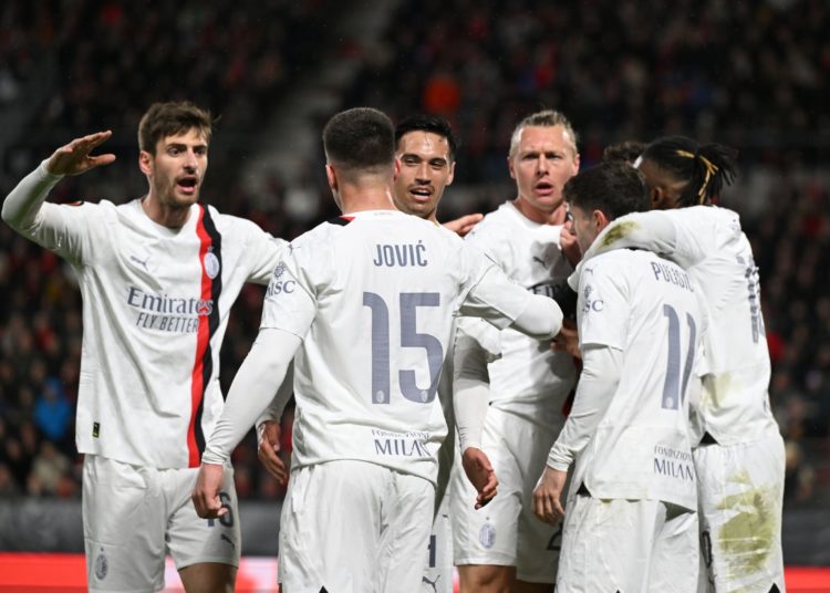 AC Milan players celebrate after scoring a goal