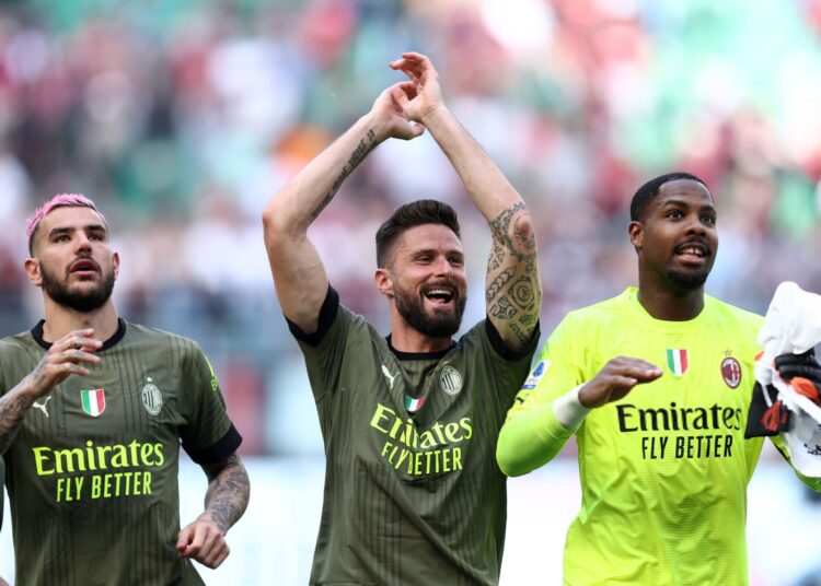 Olivier Giroud, Mike Maignan, and Theo Hernandez of AC Milan