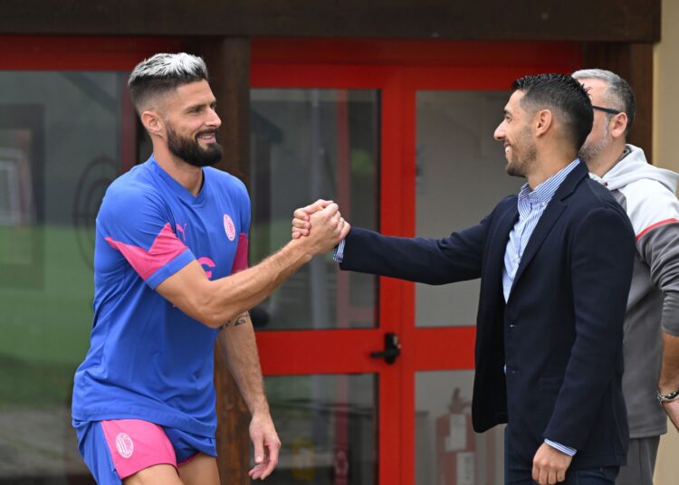 Olivier Giroud and Geoffrey Moncada (AC Milan via Getty)