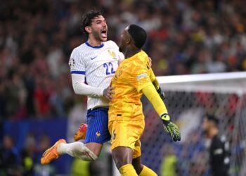 Theo Hernandez and Mike Maignan (Getty Images) مينيون ثيو