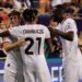 Samuel Chukwueze celebrates with teamma tes Mattia Liberali and Fikayo Tomori after scoring the team's first goal during a Pre-Season Friendly match between AC Milan and Real Madrid at Soldier Field Stadium on July 31, 2024 in Chicago, Illinois. (Photo by Justin Casterline/Getty Images)
