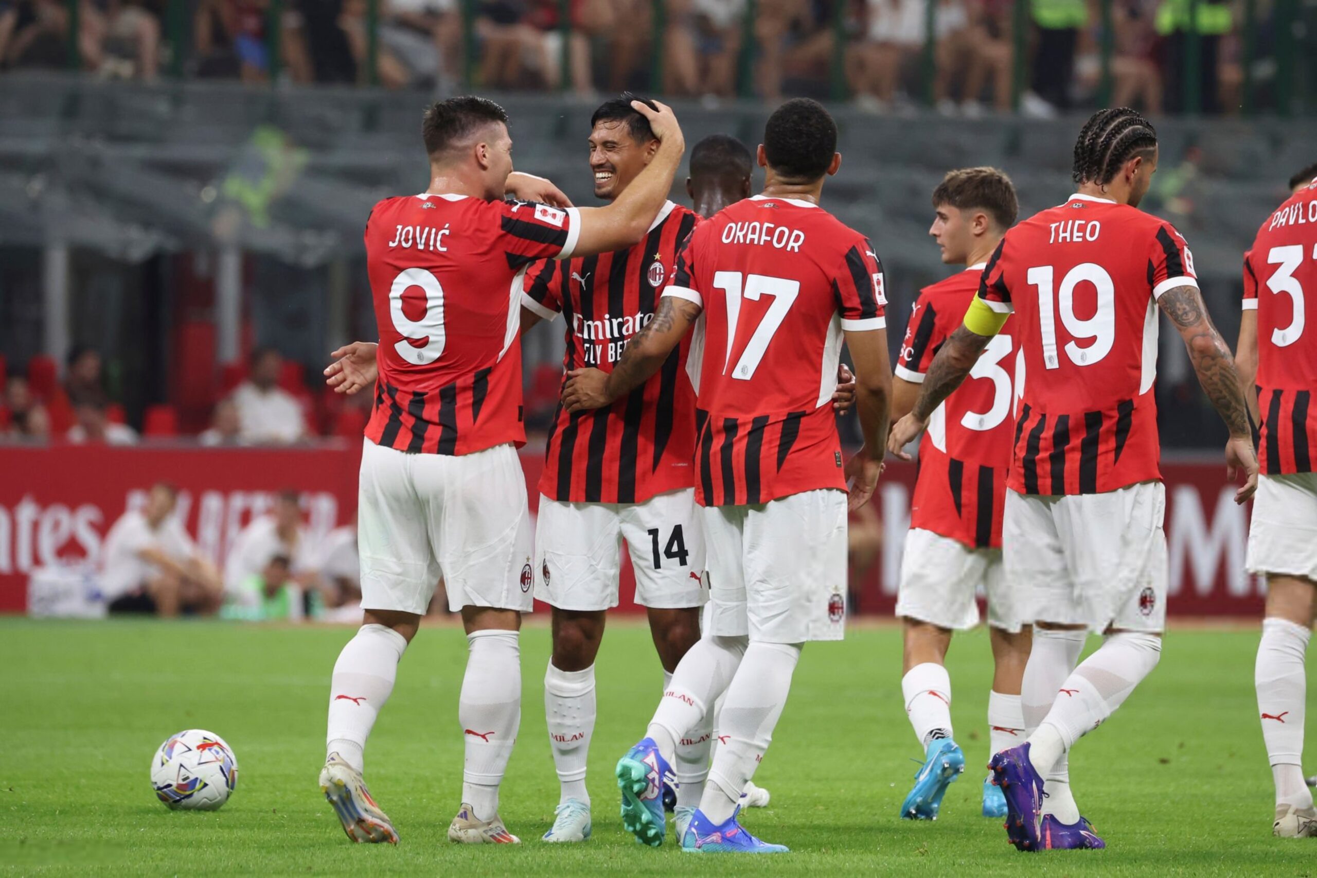 Tijjani Reijnders celebrates with Luka Jovic and teammates after scoring the team's third goal during the Trofeo Berlusconi match between AC Milan and Monza at Stadio Giuseppe Meazza on August 13, 2024 in Milan, Italy. (Photo by Giuseppe Cottini/AC Milan via Getty Images)