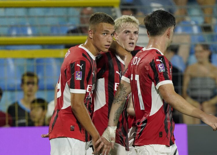 CAIRATE, ITALY - AUGUST 10: (C) Alejandro Jimenez of AC Milan Futuro celebrates his first goal during the Coppa Italia Serie C match between Lecco and Milan Futuro at Milanello on August 10, 2024 in Cairate, Italy. (Photo by Pier Marco Tacca/AC Milan via Getty Images)