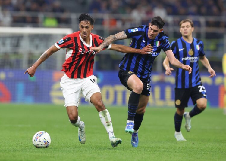 Tijjani Reijnders and Inter's Alessandro Bastoni (AC Milan via Getty Images)