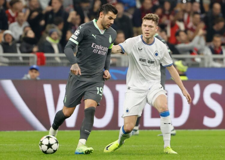 Club Brugge's Skov Olsen and Theo Hernandez of AC Milan