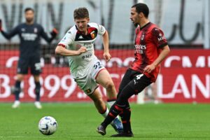 Genoa's Morten Frendrup and Ismael Bennacer of AC Milan