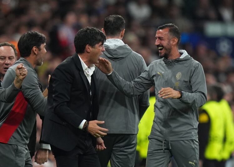 AC Milan's Paulo Fonseca celebrates with his staff after win vs Real Madrid