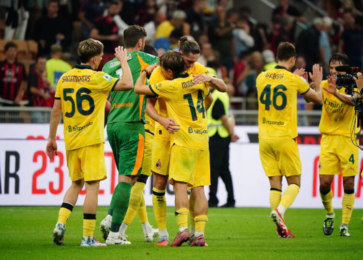 AC Milan players Luka Modric and Adrien Rabiot celebrating vs Bologna