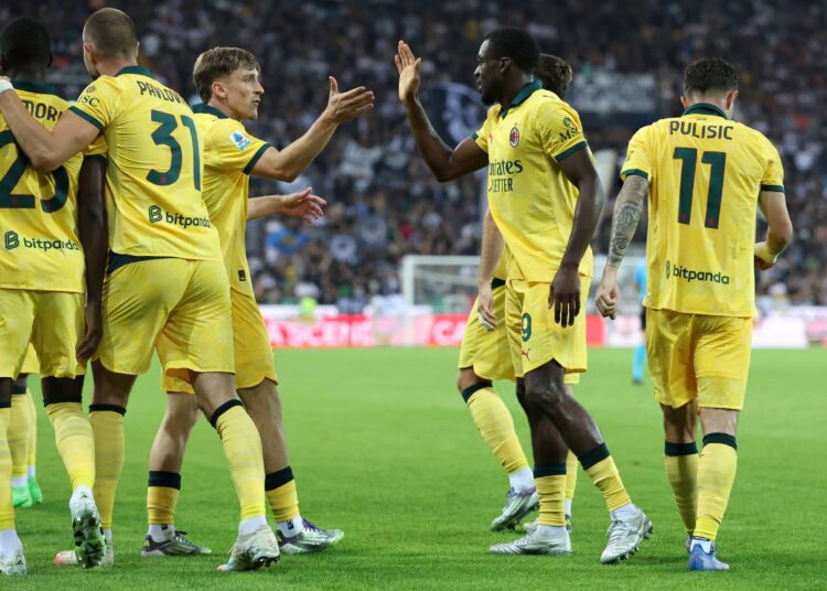 Youssouf Fofana, Alexis Saelemaekers and their AC Milan teammates celebrating a goal
