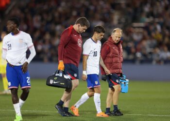 Christian Pulisic #10 of the United States leaves the game after picking up an injury during the first half against Australia during an international friendly at Dick's Sporting Goods Park on October 14, 2025 in Commerce City, Colorado. (Photo by John Dorton/ISI Photos/USSF/Getty Images)