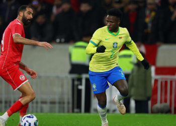 Yassine Meriah of Tunisia and Vinicius Jr of Brazil