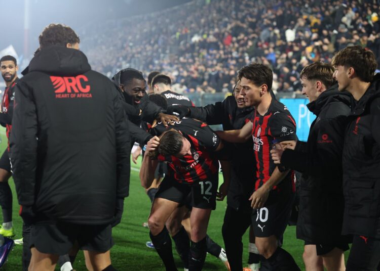 AC Milan players celebrating a goal against Como