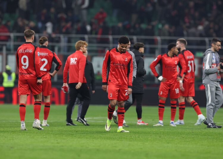 AC Milan players looking dejected