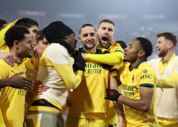 Adrien Rabiot celebrates with his AC Milan teammates