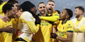 Adrien Rabiot celebrates with his AC Milan teammates