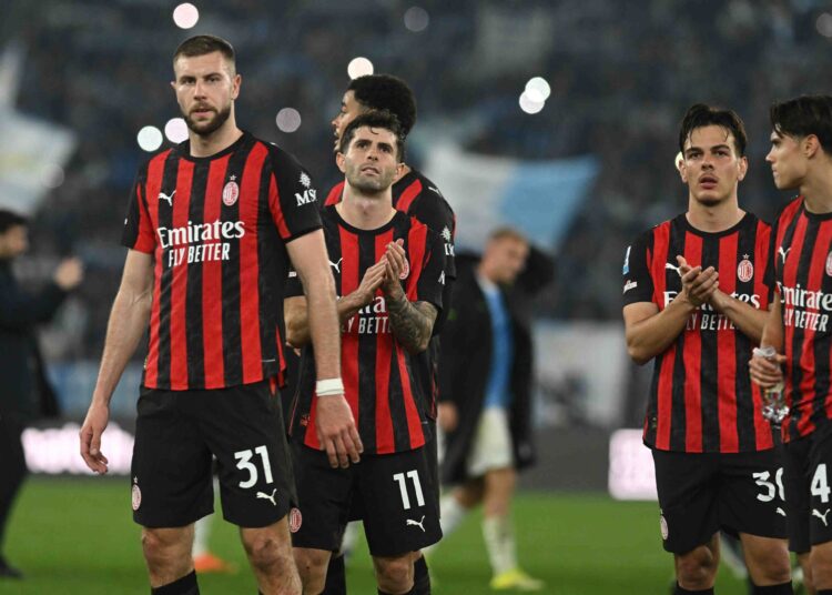 AC Milan players looking dejected after loss against Lazio