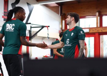 Rafael Leao (L) of AC Milan and Christian Pulisic (R) gestures during an AC Milan Training Session at Milanello on February 04, 2026 in Cairate, Italy. (Photo by Giuseppe Cottini/AC Milan via Getty Images)