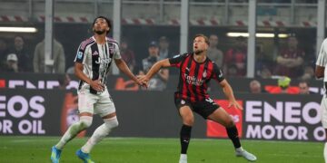 Niclas Fullkrug AC Milan and Lloyd Kelly of Juventus