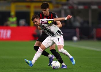Francisco Conceicao of Juventus Fc and Davide Bartesaghi of Ac Milan battle for the ball during the Serie A match between AC Milan and Juventus Fc at Stadio Giuseppe Meazza (San Siro) on April 26, 2026 in Milan Italy. (Photo by sportinfoto/DeFodi Images/DeFodi via Getty Images)