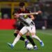 Francisco Conceicao of Juventus Fc and Davide Bartesaghi of Ac Milan battle for the ball during the Serie A match between AC Milan and Juventus Fc at Stadio Giuseppe Meazza (San Siro) on April 26, 2026 in Milan Italy. (Photo by sportinfoto/DeFodi Images/DeFodi via Getty Images)