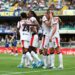 Adrien Rabiot of AC Milan celebrates with teammates after scoring against Hellas Verona