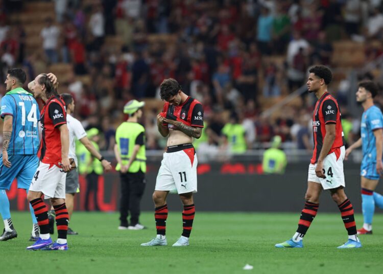 AC Milan players looking dejected