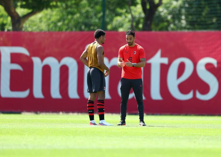 Ruben Amorim and Zachary Athekame of AC Milan
