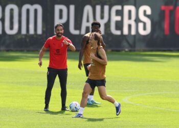 Ruben Amorim and Luka Modric of AC Milan