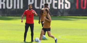 Ruben Amorim and Luka Modric of AC Milan